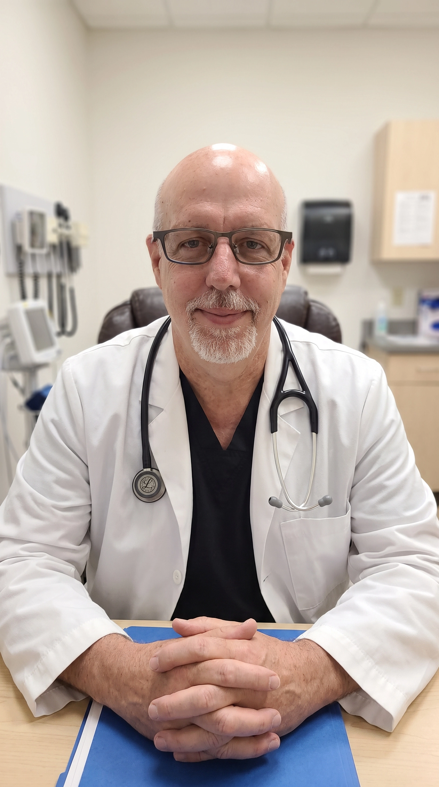 Derick McConnell, FNP-BC, in a white lab coat at Holistique Med Spa
